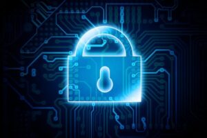 Glowing blue padlock over a dark circuit board background, symbolizing cybersecurity. 