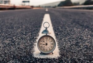 Clock in one the white line of a roadway